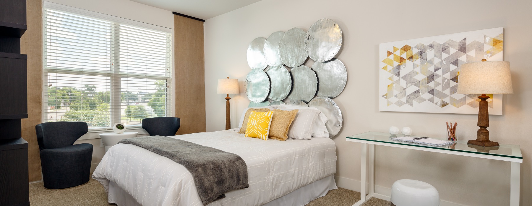 bedroom with bed ceiling fan and lamps